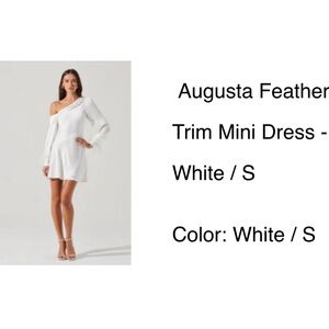 White off the shoulder dress with feathers on cuffs.
